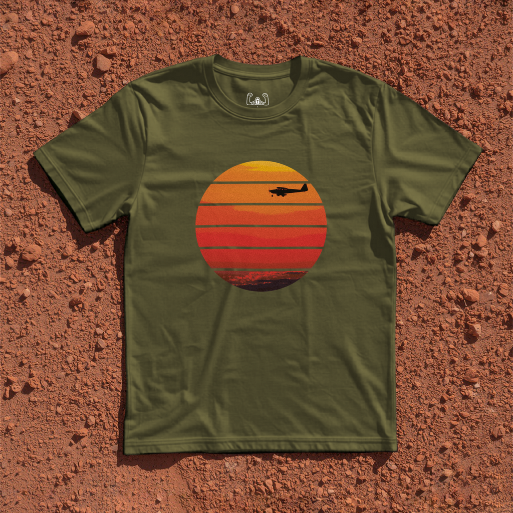 Silhouette Of A Light Airplane Cruising At Sunset Tee