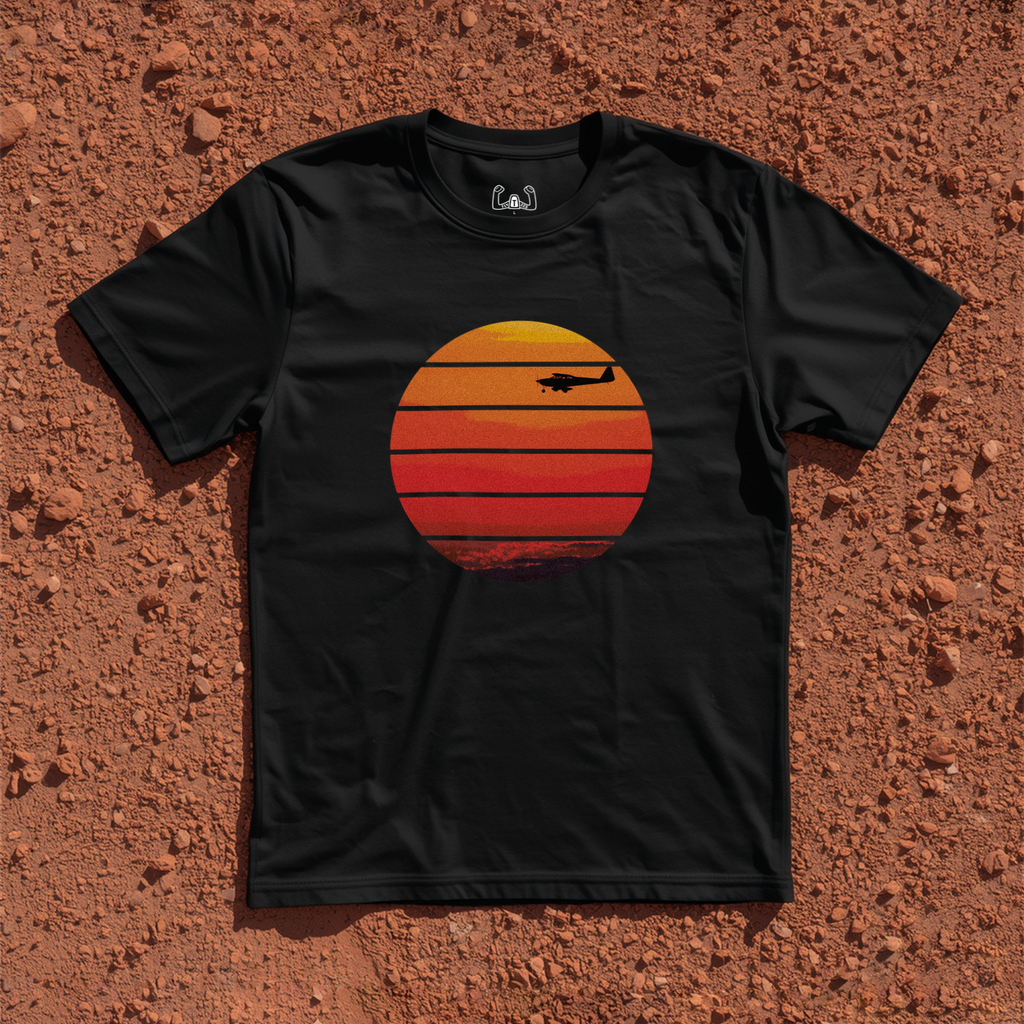 Silhouette Of A Light Airplane Cruising At Sunset Tee